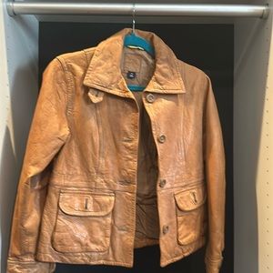 orange button down leather coat with medium pockets.